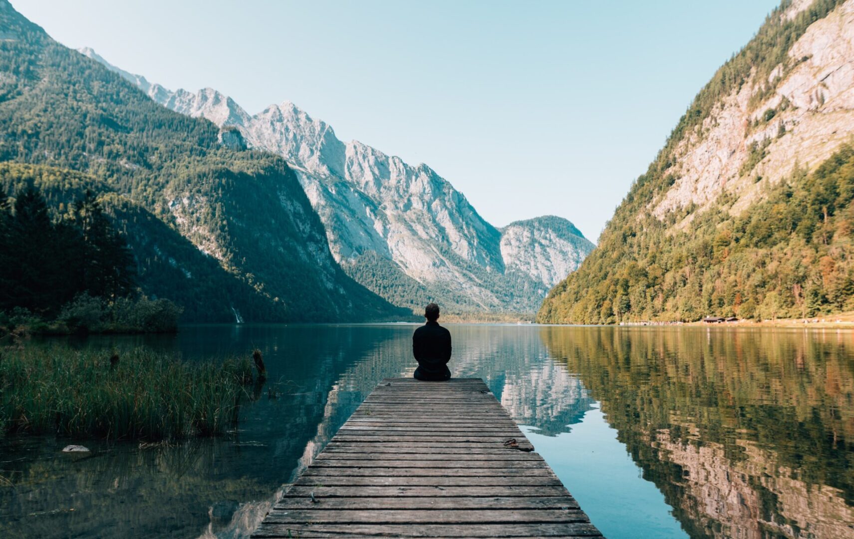 person-on-a-bridge-near-a-lake-747964